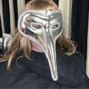 Two Venetian style masks with long noses